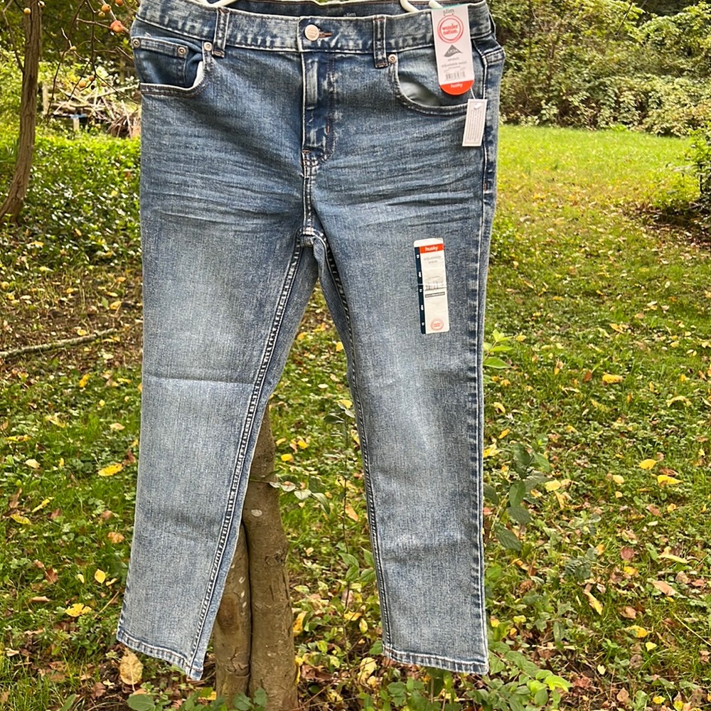 2 pairs skinny jeans. One black size 12 husky stretch jeans.  One blue 12 husky